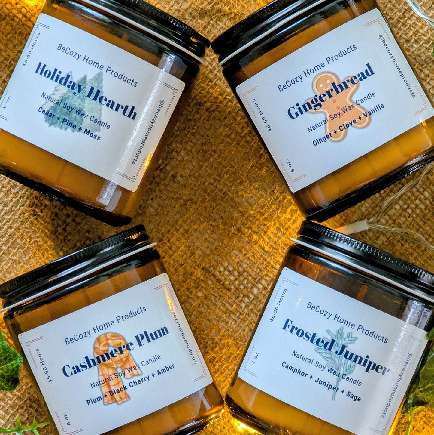 Four Holiday candles from BeCozy Home Products with labels on a textured surface.